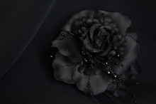 Black Flower Brooch On Black Background. Decoration, Hair Clip