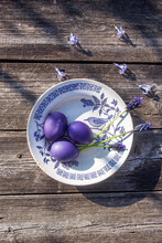 Purple Easter Eggs With Muscari And Hyacinths On A Vintage Plate