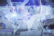Double exposure of man and woman working together and business theme hologram drawing. Computer background. Top View.