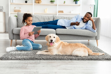 Wall Mural - Black family spending time together at home