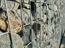 Retaining Wall Gabion Baskets, Gabion Wall Caged Stones Textured Background. Gabion Wall Caged Stones