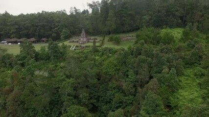 Wall Mural - Isolated Hindu temple aerial view in the green forest