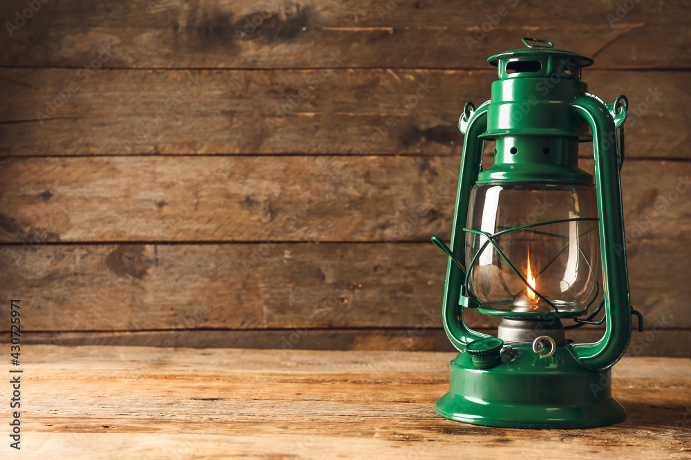 Stylish retro lamp on wooden background