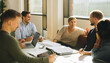 © Jacob Lund - Brainstorming session in boardroom with creative team