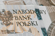 Close up on national polish bank of new Polish banknotes five hundred zloty. Macro photo of narodowy bank polski sign on PLN bill. Shallow focus. Close-up with fine and sharp texture