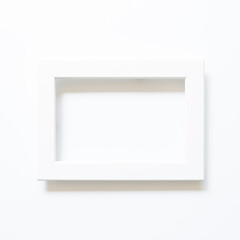 Wall Mural - White picture frame on white background. top view, copy space