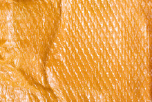 Small Yellow Post Packet Packaging Texture. Plastic Bubble Wrap Background