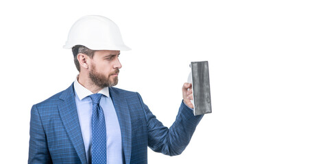 man in suit and safety helmet hold plaster trowel isolated on white copy space, plasterer.