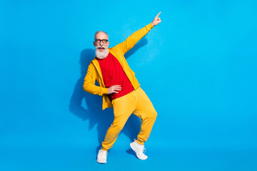 Poster - Full size photo of happy good mood cheerful grandfather dancing point finger copyspace isolated on blue color background