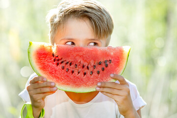 happy child eating watermelon