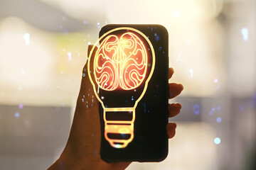 Poster - Creative light bulb illustration with human brain and hand with mobile phone on background, future technology concept. Multiexposure