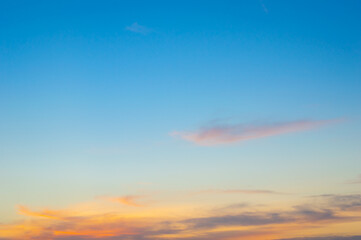 Wall Mural - beautiful sky painted by the sun leaving bright golden shades.dense clouds in twilight sky in winter
