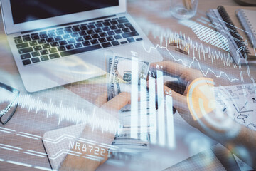 Fototapete - Multi exposure of Tech drawing hologram and USA dollars bills and man hands. Technology concept.