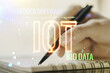 © Pixels Hunter - Creative IOT hologram with woman hand writing in notepad on background, internet of things concept. Multiexposure
