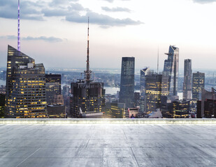 Empty dirty concrete rooftop on the background of a beautiful New York city skyline at twilight, mock up