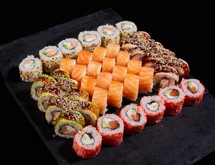 Sticker - Large square stone board with sushi set of different types of rolls.