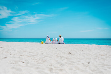 happy family with two kids on tropical beach vacation