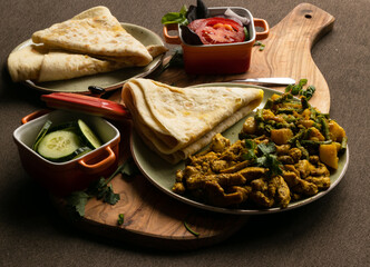 Indian-surinamese spicy food lunch and dinner, roti chicken curry