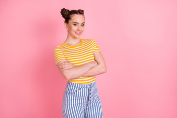 Wall Mural - Portrait of half turned attractive person folded hands toothy smile isolated on pink color background