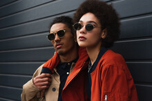 Young African American Woman Posing With Stylish Man In Sunglasses Outside