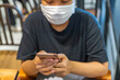 © Quang - Woman wearing medical mask to prevent Covid-19 infection in public place