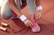 © ivanko80 - Runner tying jogging shoes