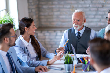 Wall Mural - Coworkers discussing about new project in office