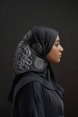 Profile of young arabic girl in traditional hijab