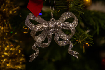 Decorated Christmas tree on blurred background.