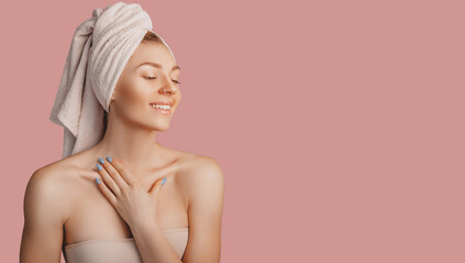 Wall Mural - beautiful sensual young girl with clean skin on a pink background with a mockup. topless woman in a 