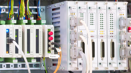 Poster - View of communication port module on PLC unit in control box of automation machine