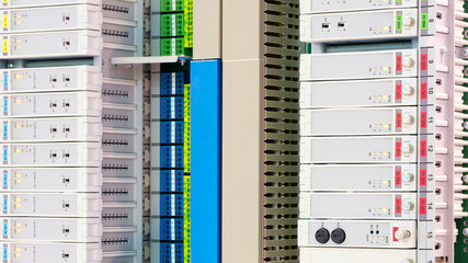 Poster - View of communication port module on PLC unit in control box of automation machine