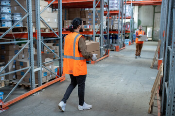 Storage workers moving boxes