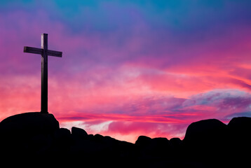 Wall Mural - Christian cross over beautiful sunset background