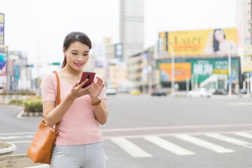 Canvas Print - woman use phone while commuting