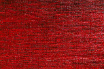 abstract creative background: red stain of colored primer when toning the canvas, temporary object.