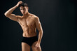 © SHOTPRIME STUDIO - handsome man with pumped up muscular body bodybuilder studio dark background