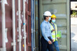 © NVB Stocker - Technical expert in solar photovoltaic panels holding light bulb in hand and discussion with engineer woman in new project. Engineer wearing hygienic mask and protective hard hat.