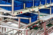 © Surasak - basket or plastic box container on roller rack or aluminum shelf with electronic display smart module system for management – control or operate stock such as quantity and data information etc