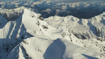 Wall Mural - 4k aerial dramatic mountains winter sunset