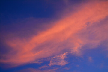 Amazing view of sunrise sky with red clouds. Nature background. Dramatic clouds on the sky in red colors