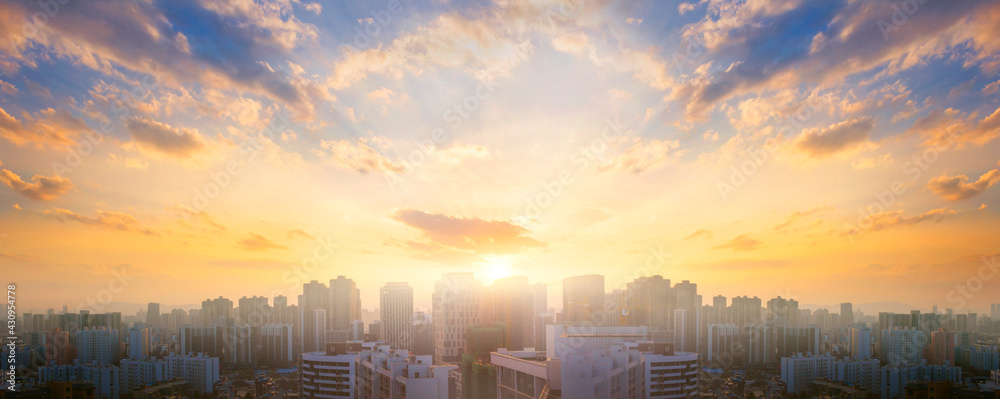 City day concept: Beautiful sunset sky over city - obrazy, fototapety, plakaty 