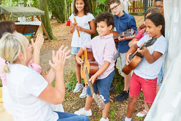 Group of children at talent show performance in summer camp