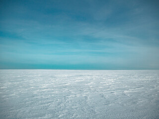 almost clear and blue sky, almost flat and clean snow