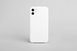 White iphone 11 isolated on gray background, phone case mock up, smart phone back view