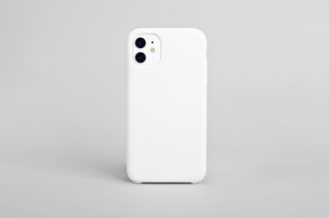 Poster - White iphone 11 isolated on gray background, phone case mock up, smart phone back view