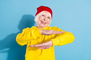 Sticker - Photo of attractive old cool woman dance hip-hop wear red hat hoodie isolated on blue color background