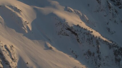 Wall Mural - 4k aerial dramatic mountains winter sunset