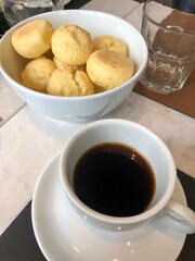 The traditional brazilian cheese bread, pao de queijo, with coffee