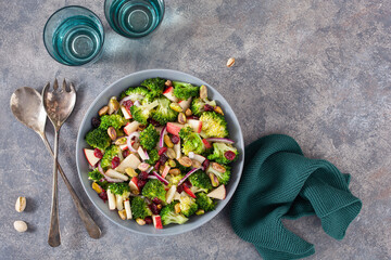 healthy broccoli salad with apple onion dried cranberries pistachio. vegan low carb diet